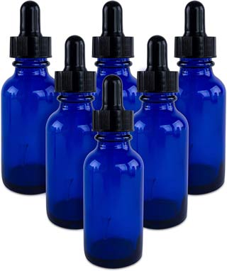 Blue bottles are perfect for storing green dragon tincture from this recipe.